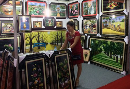 Historia de la aldea de los bordados de Quat Dong en Hanoi - ảnh 2