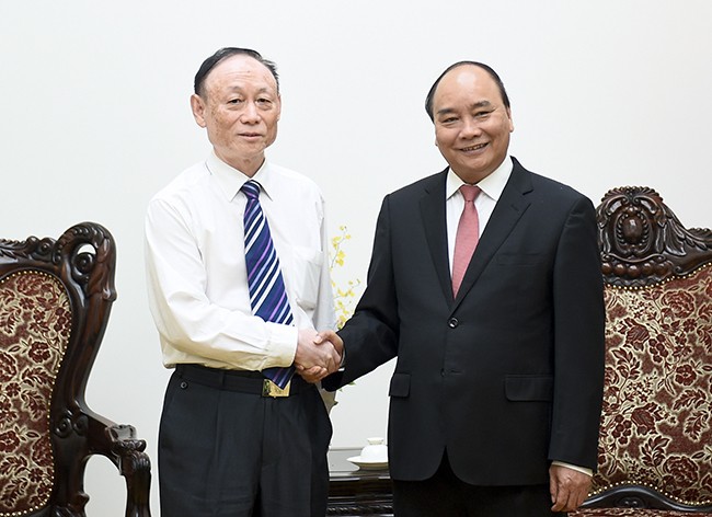 นายกรัฐมนตรีให้การต้อนรับประธานเครือบริษัทJA Solar - ảnh 1