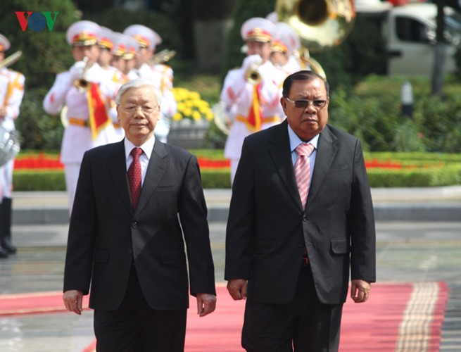 Lễ đón chính thức Tổng Bí thư, Chủ tịch nước Lào tại Hà Nội - ảnh 9