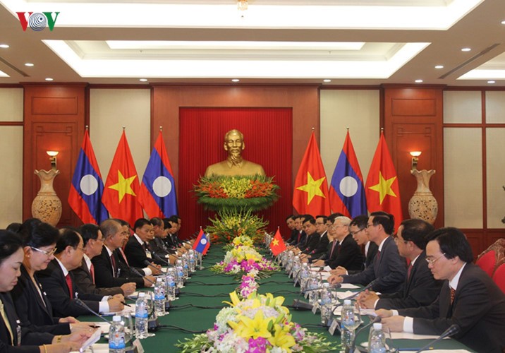 Lễ đón chính thức Tổng Bí thư, Chủ tịch nước Lào tại Hà Nội - ảnh 10