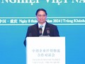 PM Pham Minh Chinh Menghadiri Simposium Badan Usaha Vietnam-Tiongkok