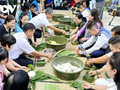 Southwestern coastal soldiers wrap Chung cakes for Tet