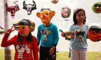 Making paper masks for Mid-autumn festival