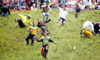 Thrills and spills at UK’s cheese rolling race