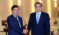 Deputi PM, Menlu Pham Binh Binh Minh mengadakan pertemuan dengan PM Tiongkok, Li Keqiang dan Deputi PM Rusia, Arkady Dvorkovich