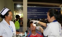 Vietnam supports poor patients  in Laos