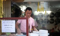 Bowls of spicy beef noodle soup warm poor workers