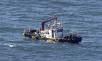 Japan says seawater radioactivity below limits near Fukushima