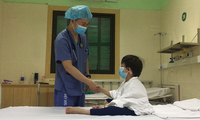 7-year-old boy, Vietnam's youngest heart transplant recipient, goes home