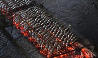 Grilled fish making village busy on scorching summer days