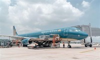 Vietnam Airlines flight carries first foreign tourists after Vietnam fully reopens border