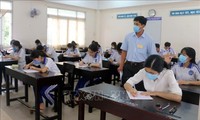 Final high school examination held in safe, serious manner