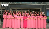 Women donning “ao dai” shine at work 