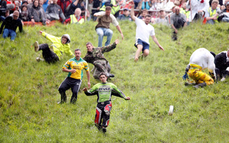 Thrills and spills at UK’s cheese rolling race
