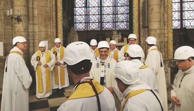 Worshippers in safety hats attend Notre-Dame's first mass since fire