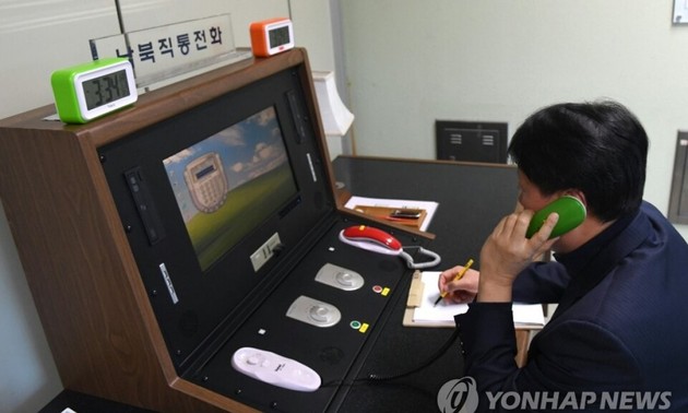 Two Koreas reopen hotlines 