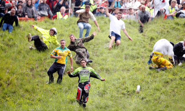 Thrills and spills at UK’s cheese rolling race