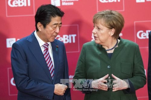 Japan, Germany commit to defending free trade