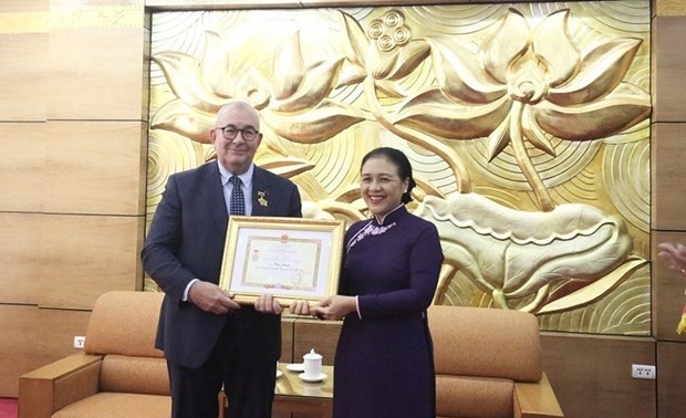 Belgian Ambassador given “For peace and friendship among nations” insignia 