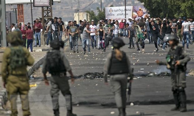 Israelis, Palestinians pledge to curb violence 