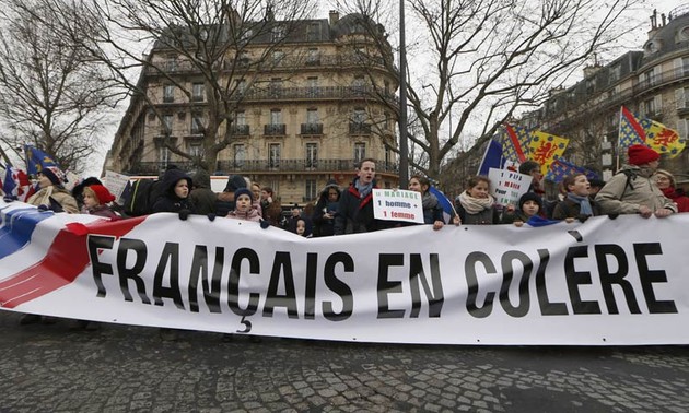 Thousands protest French President