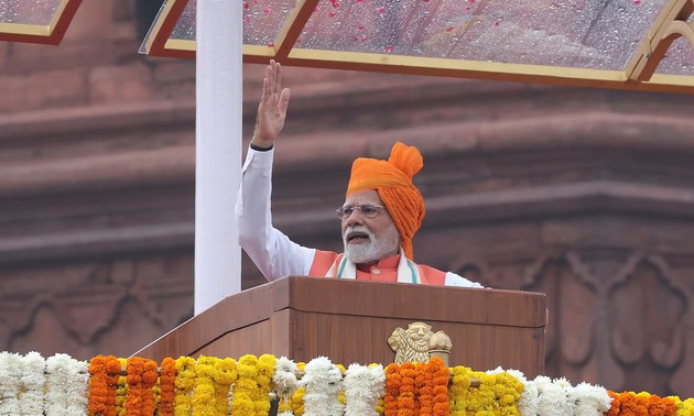 India's Modi vows to protect farmers, cuts tax, pushes self-reliance