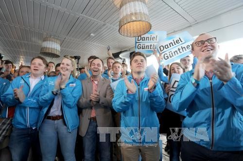 Allemagne: la CDU d'Angela Merkel remporte une élection régionale-test