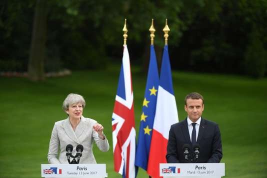 May cherche le soutien de Macron à Paris