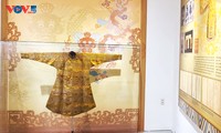 Exhibit features Nguyen dynasty attire and headgear