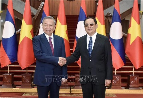 To Lam se reúne con el Primer Ministro de Laos - ảnh 1