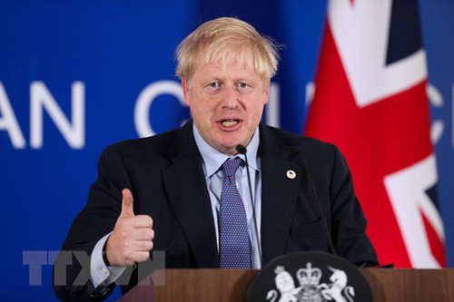 Masalah Brexit: PM Inggris meminta supaya mengadakan pemilu lebih dini kalau ingin menunda Brexit - ảnh 1