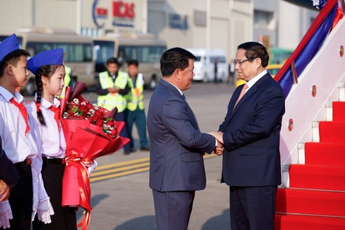 PM Vietnam, Pham Minh Chinh Tiba di Ibu Kota Vientiane, Mulai Kunjungan di Laos - ảnh 1