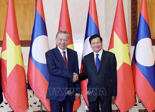 Lao Party General Secretary, State President congratulates Vietnamese counterpart - ảnh 1