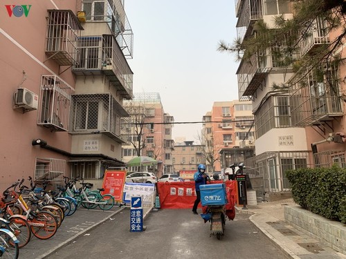 Ảnh: Đường phố Bắc Kinh vắng lặng vì dịch Covid-19 - ảnh 17