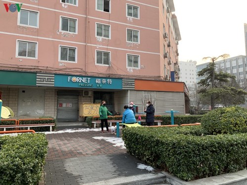 Ảnh: Đường phố Bắc Kinh vắng lặng vì dịch Covid-19 - ảnh 19