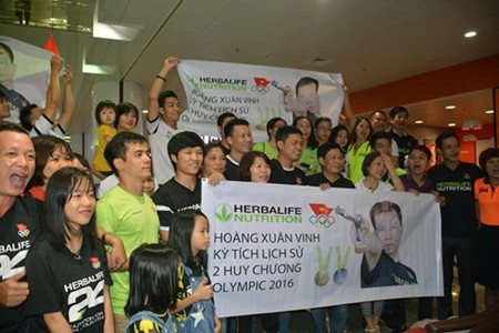 Orgullo y esperanza en el recibimiento al deportista vietnamita con dos medallas olímpicas - ảnh 1