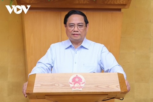 PM Pham Minh Chinh chairs August government meeting - ảnh 1