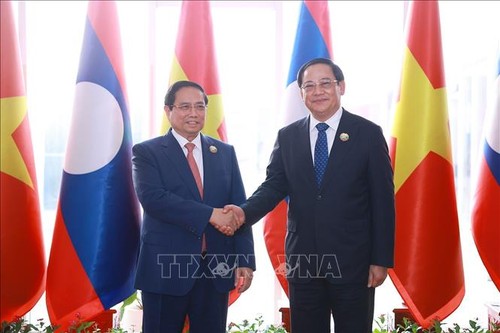 Concluye con éxito la visita del Primer Ministro de Vietnam a Laos - ảnh 1