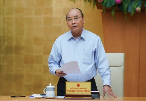 Premierminister Nguyen Xuan Phuc: Vietnam hat die Covid-19 grundsätzlich beseitigt - ảnh 1