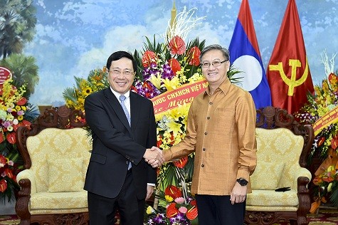 Deputi PM Vietnam, Pham Binh Minh mengucapkan Hari Raya Tahun Baru Bunpimay, Laos - ảnh 1