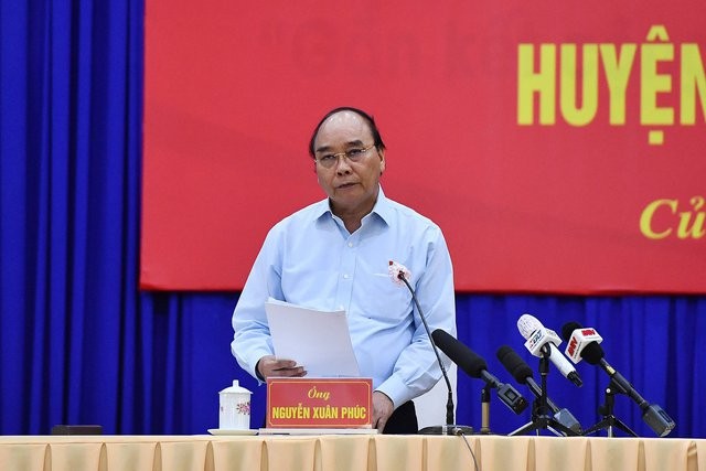 ប្រធានរដ្ឋ លោក Nguyen Xuan Phuc អញ្ជើញជួបសំណេះសំណាលជាមួយម្ចាស់ឆ្នោតនៅស្រុក Cu Chi និង ស្រុក Hoc Mon - ảnh 1