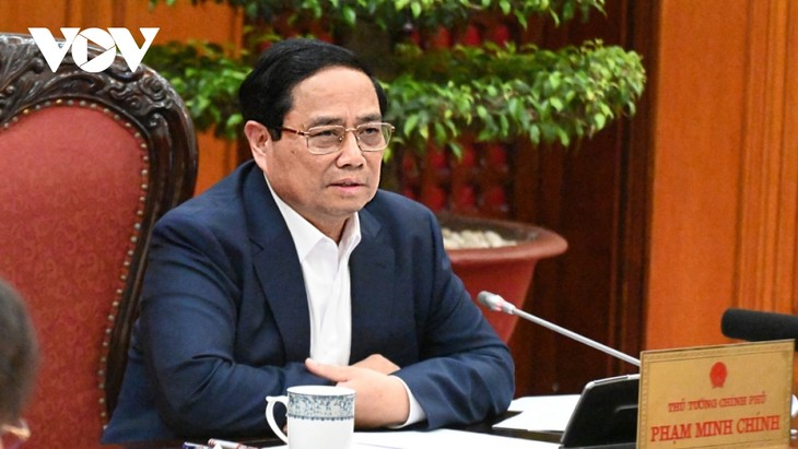 PM Vietnam, Pham Minh Chinh Memimpin Sidang tentang Kebijakan Moneter - ảnh 1