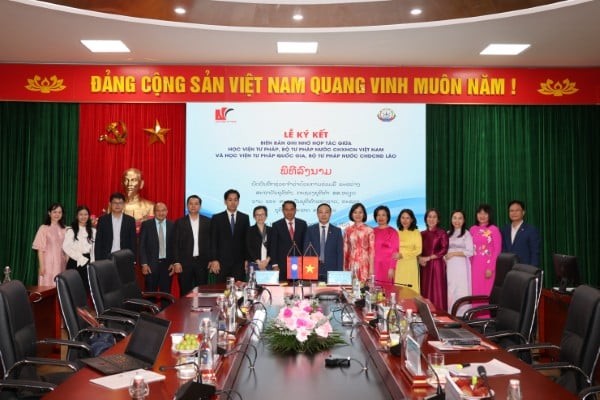 Kerja Sama Erat antara Akademi Kehakiman Vietnam dan Akademi Kehakiman Nasional Laos - ảnh 1