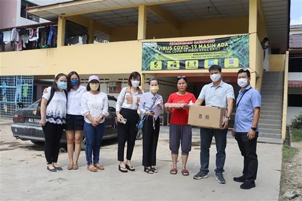 Dukung Orang Vietnam di Malaysia yang Terkena Banjir - ảnh 1