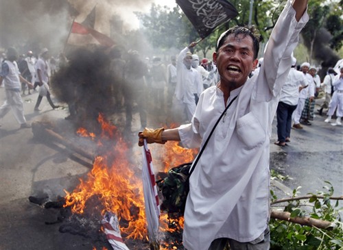 OIC merekomendarikan penyusunan undang-undang internasional tentang melarang pelangaran dan pelecehan terhadap Tuhan. - ảnh 1