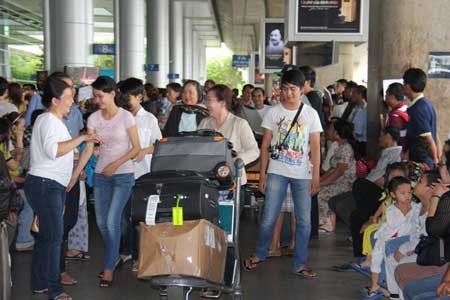 Pertemuan dengan para diaspora Vietnam yang pulang kembali di kampung halaman untuk menyambut Hari Raya Tet - 2014 - ảnh 1