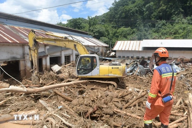 中国南部、集中豪雨で１３人死亡　１万人避難 - ảnh 1