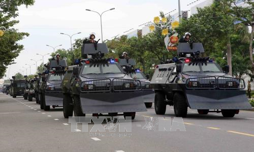 Acara gladi bersih apel pemberangkatan  dan latihan untuk menjaga Pekan Tingkat Tinggi APEC - ảnh 1