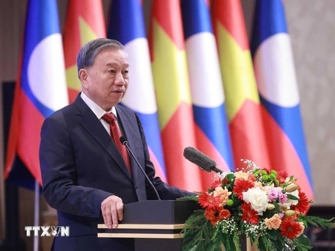 Party General Secretary attends state banquet hosted by Lao leader - ảnh 1