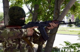 ウクライナ東部で戦闘激化　住民１４万人がロシアへ避難 - ảnh 1